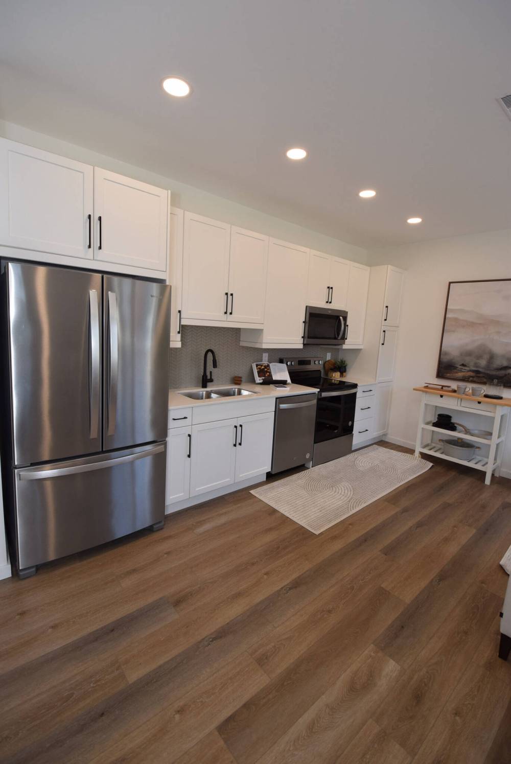 TODD LEWYS / FREE PRESS
Kitchens in both units — which include four appliances — were placed along the wall to open up space in both the living room and dining area.