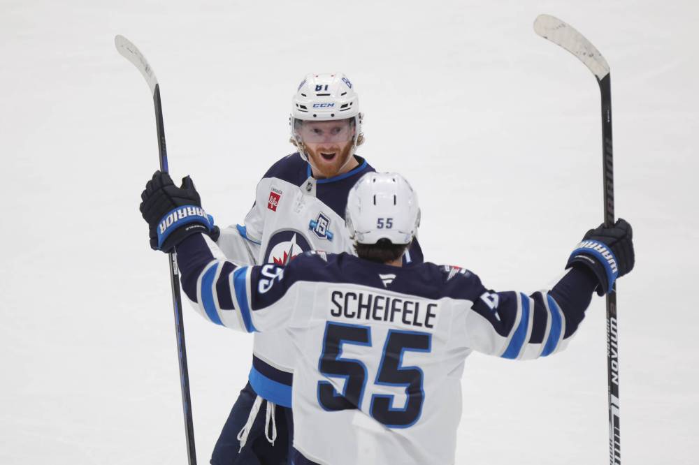 Paul Vernon / The Associated Press
Both Winnipeg Jets forward Kyle Connor (left) and linemate Mark Scheifele are nearing milestones which they should hit if the needed victories pile up.