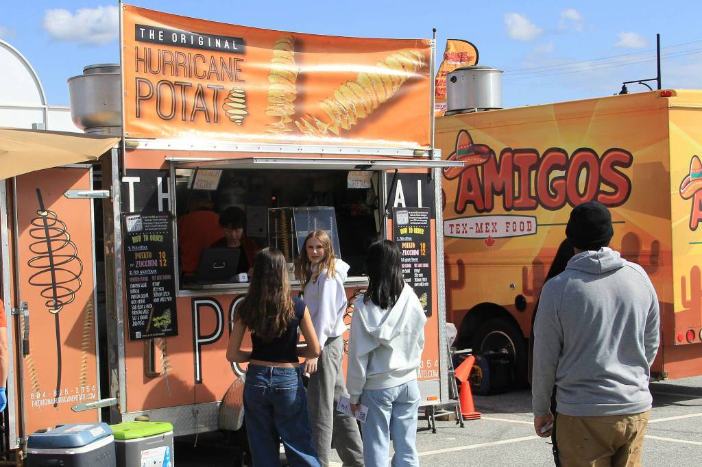 People line up to sample food truck wares at the 2025 Food Truck Wars festival on the Cloverdale Fairgrounds. Food Truck Wars is back this weekend at the Cloverdale Fairgrounds, running April 10-12. (Photo: Malin Jordan)