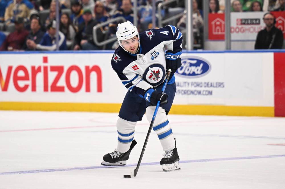 Connor Hamilton / The Associated Press
Winnipeg Jets’ Neal Pionk looks to pass during the first period.
