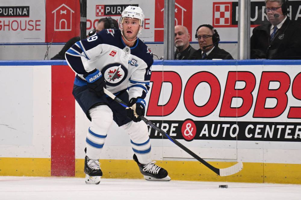 Connor Hamilton / The Associated Press
Winnipeg Jets’ Jonathan Toews controls the puck during the second period.