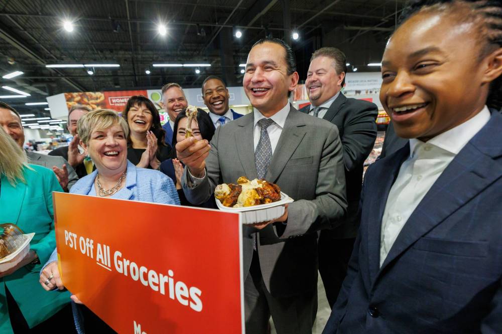 MIKE DEAL / FREE PRESS FILES
Premier Wab Kinew uses a rotisserie chicken to demonstrate the PST exemption on ready-made food and other grocery items in the NDP’s newly-tabled budget, during a March press conference. Restaurants appear to have been left out of the affordability measure.