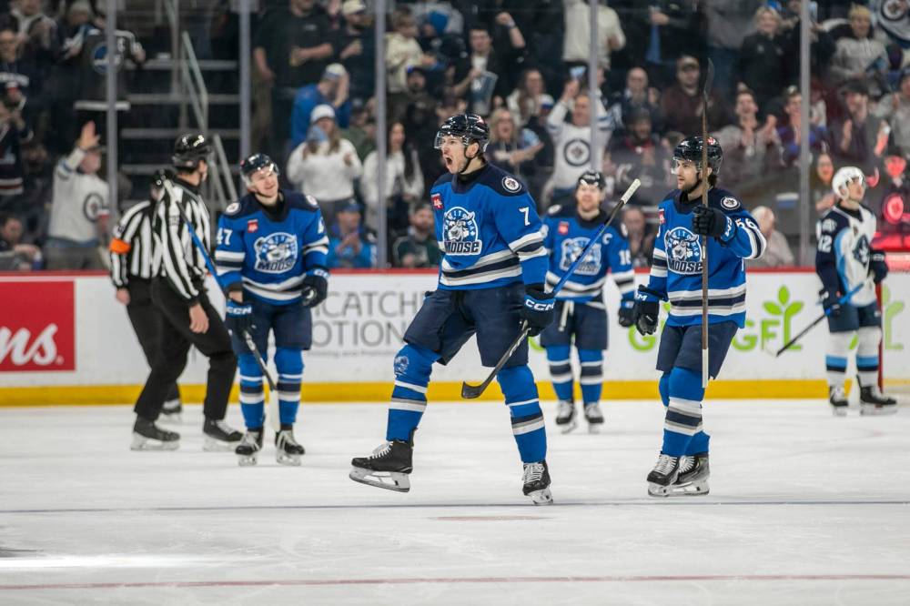 BROOK JONES / FREE PRESS
Manitoba Moose right-winger Walker Duehr (No. 7) celebrates after scoring the first goal of the game in the first period.