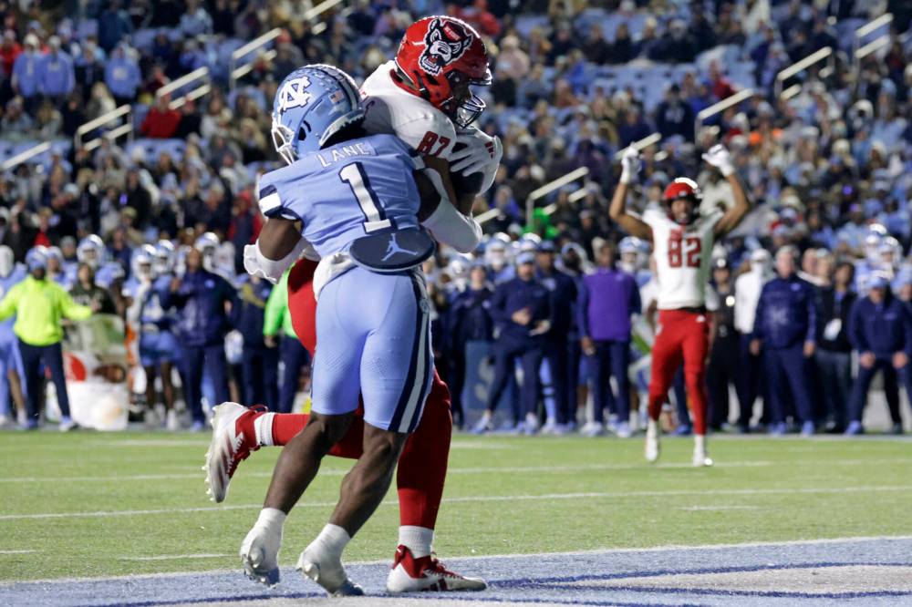 Chris Seward / The Associated Press files
North Carolina State tight end Dante Daniels hauls in a touchdown pass against North Carolina in 2024. The Bombers expect to use him as receiver who will help out their run game.