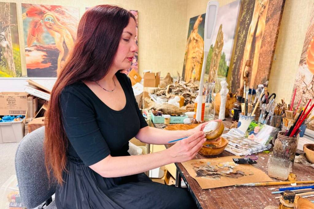 Metchosin artist Debra Bernier carefully carves driftwood into artwork using themes of nature, motherhood and human emotions. (Nishadini Fonseka/ Goldstream Gazette)