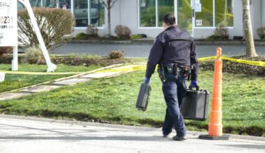 Investigators are seen after a shooting in the 5400-block of Production Boulevard March 23. Police say more shots were fired at the business complex in the early hours of March 30. (Dan Ferguson/Langley Advance Times)