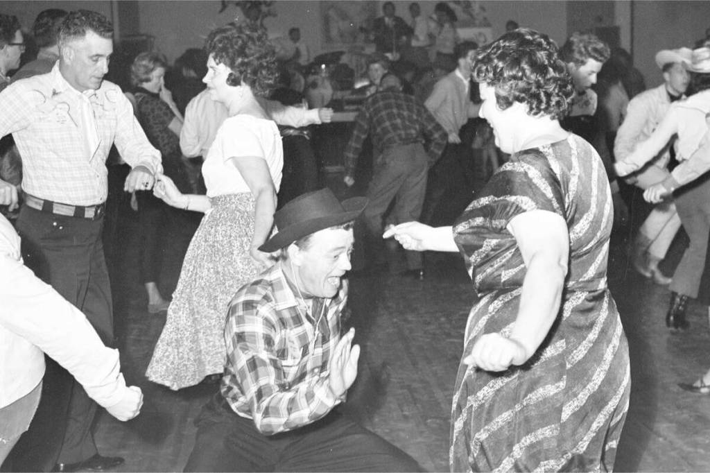 People enjoy themselves at the Cloverdale Rodeo Dance in 1964. The Cloverdale District Chamber of Commerce and the Cloverdale Rodeo Youth Initiative Foundation have brought back the classic rodeo event that will kick off Rodeo Month in Surrey. (Photo courtesy Surrey Archives/Surrey Leader Photograph Collection)