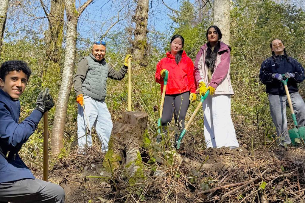 Volunteers with the Lower Mainland Green Team spent a sunny long weekend Saturday (April 4) removing invasive plants at Ruth Johnson Park in White Rock. (Contributed to Peace Arch News)