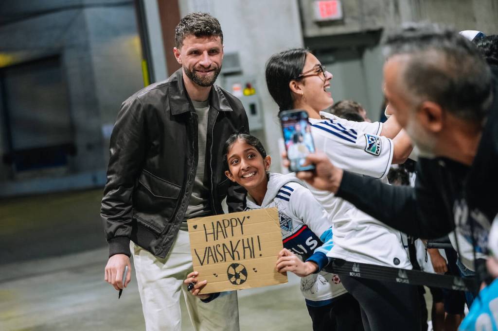 Star player Thomas Müller with a young fan at Vancouver Whitecaps FC&rsquo;s annual Vaisakhi Match at BC Place Stadium on Saturday, April 4, 2026. (Bob Frid/Contributed to Surrey Now-Leader)