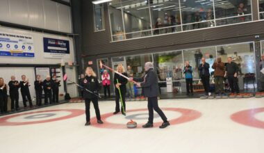Pat Elliott, left, White Rock Mayor Megan Knight, and Cathy Stewart participate in the delivery of the ceremonial opening stone at the Peace Arch Curling Club&rsquo;s Nifty Fifty Provincial Senior Ladies bonspiel. (Leo Le Couteur photo)