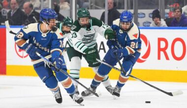Goldeneyes Jenn Gardiner and Sarah Nurse battle Liz Schepers for the puck during Tuesday&rsquo;s (April 7) game at Rogers Arena in Edmonton. (PWHL)