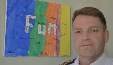 Brian Edwards pictured when he was Surrey RCMP&rsquo;s officer in charge and assistant commissioner, with a painting his son did in Grade 4 that he hung in a place of honour on his office wall. (Tom Zytaruk/Surrey Now-Leader file)