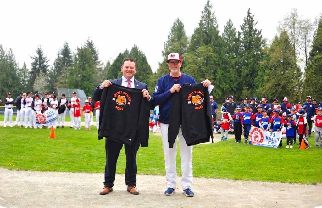 Whalley Little League president Clint Stewart, left, and Surrey Canadian Baseball Association president David Leavers with Surrey Whalley Bears shirts at Lionel Courchene Park on Sunday, April 12, 2026. (Facebook.com photo)