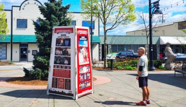 A man checks out a new sign in Hawthorne Square in Cloverdale advertising the upcoming 78th Cloverdale Rodeo and 135th Country Fair. (Photo: Malin Jordan/Cloverdale Reporter)
