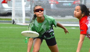 Thea Highwarden with Guildford Park Sabres ultimate team (in green) throws the disc during a game with Holy Cross Crusaders at Hjorth Road Park in Surrey on April 10, 2026. (Tom Zillich/Surrey Now-Leader)