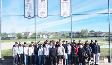 Players, parents, friends, and baseball volunteers met at Hillcrest Park April 18 to raise a national championship banner. The Cloverdale Rangers 18U College Prep baseball team won the 2025 title in August last year at nationals in Fort McMurray, Alberta. (Photo: Malin Jordan/Cloverdale Reporter)
