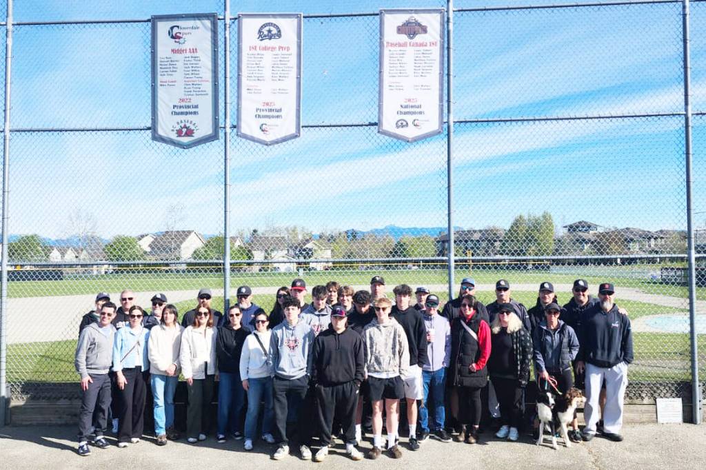Players, parents, friends, and baseball volunteers met at Hillcrest Park April 18 to raise a national championship banner. The Cloverdale Rangers 18U College Prep baseball team won the 2025 title in August last year at nationals in Fort McMurray, Alberta. (Photo: Malin Jordan/Cloverdale Reporter)