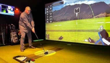 Jordie MacKay at the Studio Swing golf simulator he built and operates in a Surrey garage. (Tom Zillich/Surrey Now-Leader)