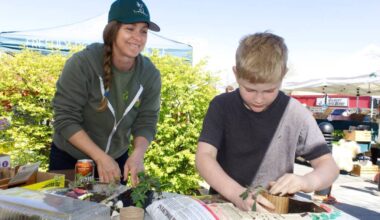 Exploring his green thumb, Adam Schaus tamps more dirt into his just planted seedling under the direction of Melanie Bennett with the Shuswap Food Action Society at Salmon Arm&rsquo;s 4th Annual Earth Day Celebration in the Ross Street Plaza Saturday, April 25. (Heather Black-Salmon Arm Observer)