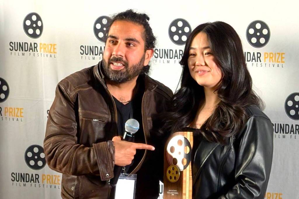 Sidartha Murjani, executive director and senior programmer of Sundar Prize Film Festival, with Hannah Yang, winner of Best BC Short Film award (for &ldquo;Red Light Rebel&rdquo;) at the 2026 festival awards event at Landmark Cinemas Guildford in Surrey on April 26, 2026. (Contributed to Surrey Now-Leader)