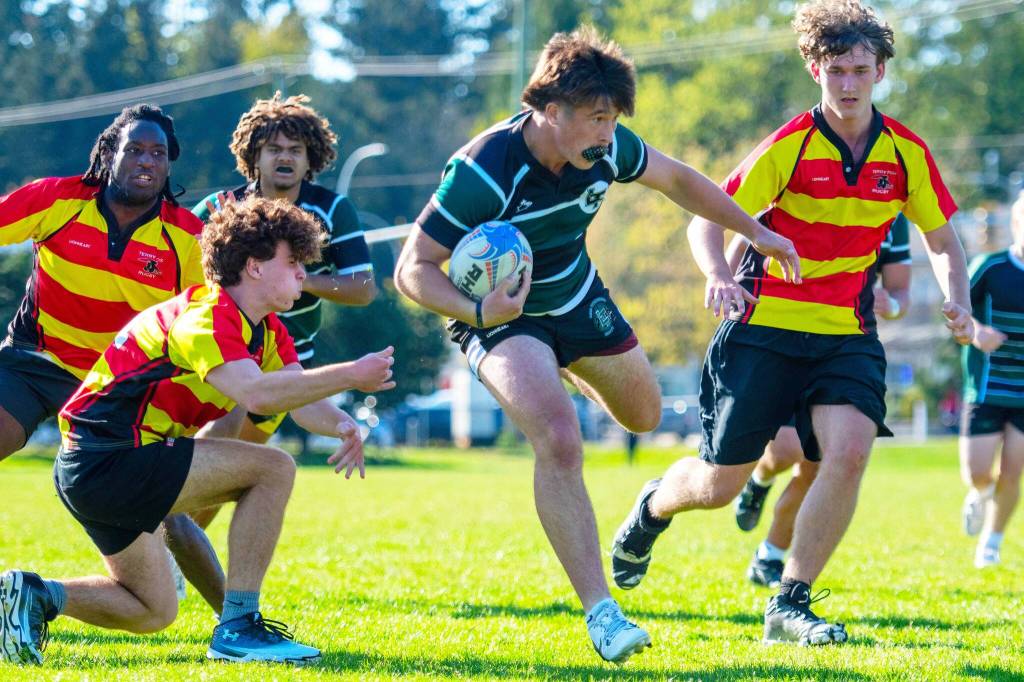 Lord Tweedsmuir rugby player Jerin Harinen crashes through a line of Terry Fox Raven defenders April 24 on his way to both man-of-the-match honours and a 25-point performance. (Photo: Brooklynne Stephens/Submitted to Cloverdale Reporter)
