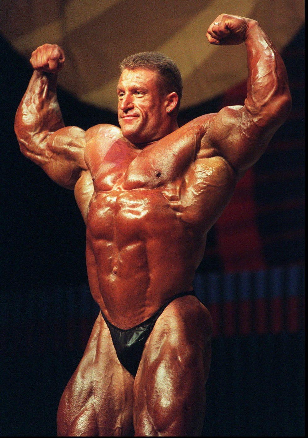 2pfe0mt mr. olympia winner dorian yates of birmingham, england shows his stuff during his individual posing on stage at the 33rd annual joe weiders mr. olympia contest at the terrace theater in long beach, calif. saturday, sept. 20, 1997. yates won his sixth straight title. (ap photo/long beach press telegram, ken kwok)