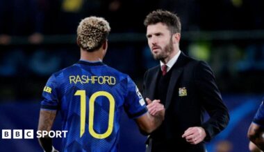 Michael Carrick greets Marcus Rashford