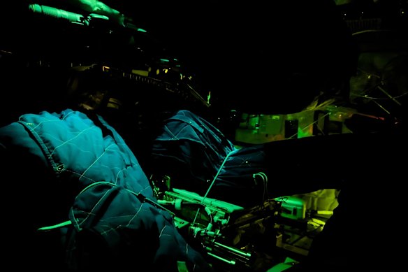Artemis II crew member sleeping bags are illuminated inside the Orion spacecraft.