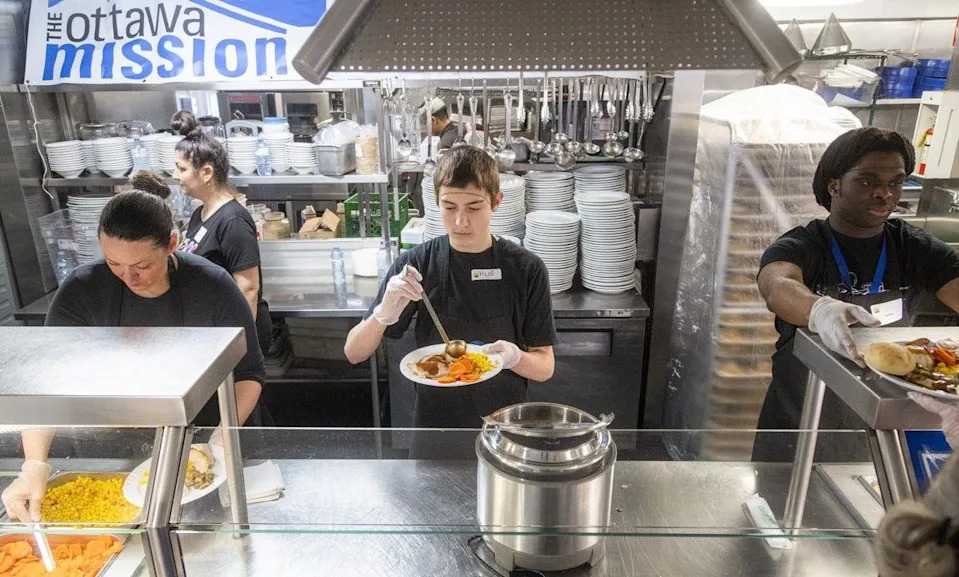  Milos Kljajic was helping serve meals as a volunteer Sunday.