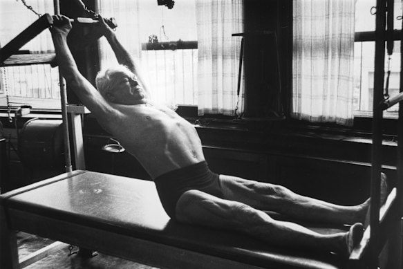 Joseph Pilates, inventor of Pilates, exercising in his New York City studio, circa 1960.
