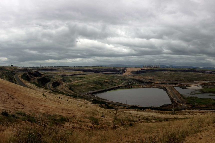 A retired mine pit containing water.