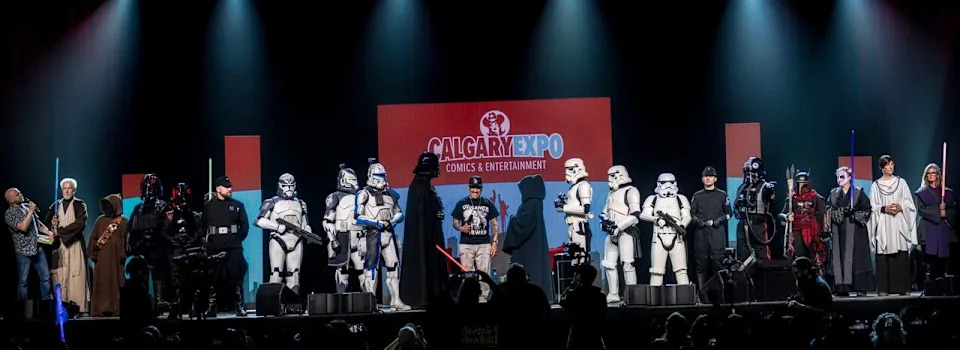 Star Wars fans in costumes join actor Danny Trejo on stage at Calgary Expo in 2024.