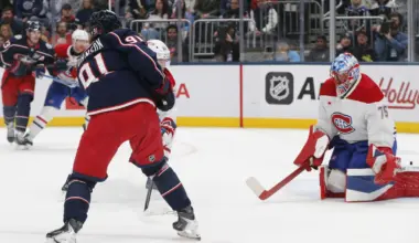 Montreal Canadiens goalie Jakub Dobes (75) makes a save on the shot attempt of Columbus Blue Jackets center Kent Johnson (91) during the second period at Nationwide Arena.