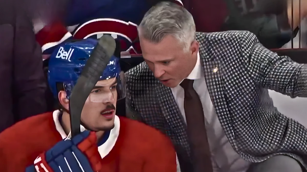 Photo of Arber Xhekaj and Martin St-Louis on the bench.