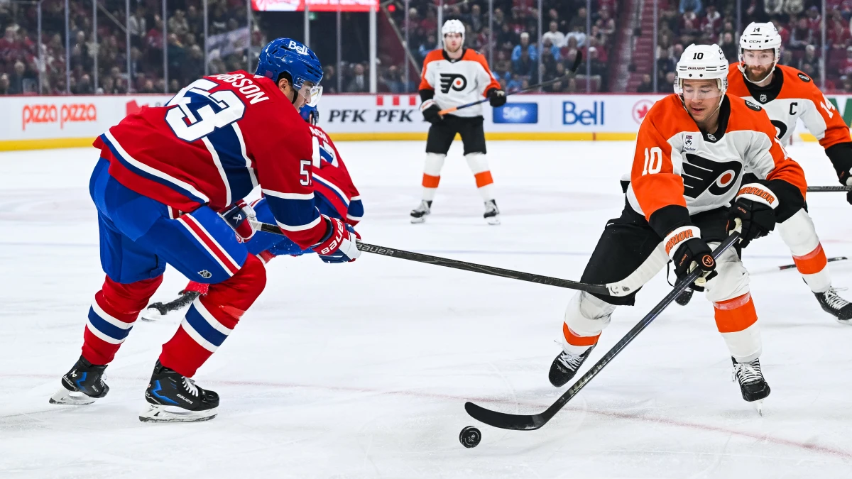 Philadelphia Flyers right wing Bobby Brink (10) plays the puck against Montreal Canadiens defenseman Noah Dobson (53) during the first period at Bell Centre.