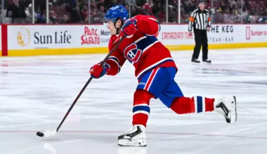 Montreal Canadiens right wing Cole Caufield (13) shoots the puck against the Boston Bruins during the second period at Bell Centre.