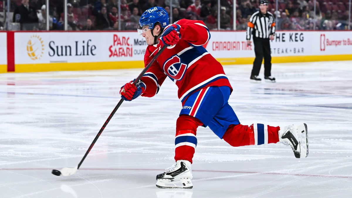 Montreal Canadiens right wing Cole Caufield (13) shoots the puck against the Boston Bruins during the second period at Bell Centre.