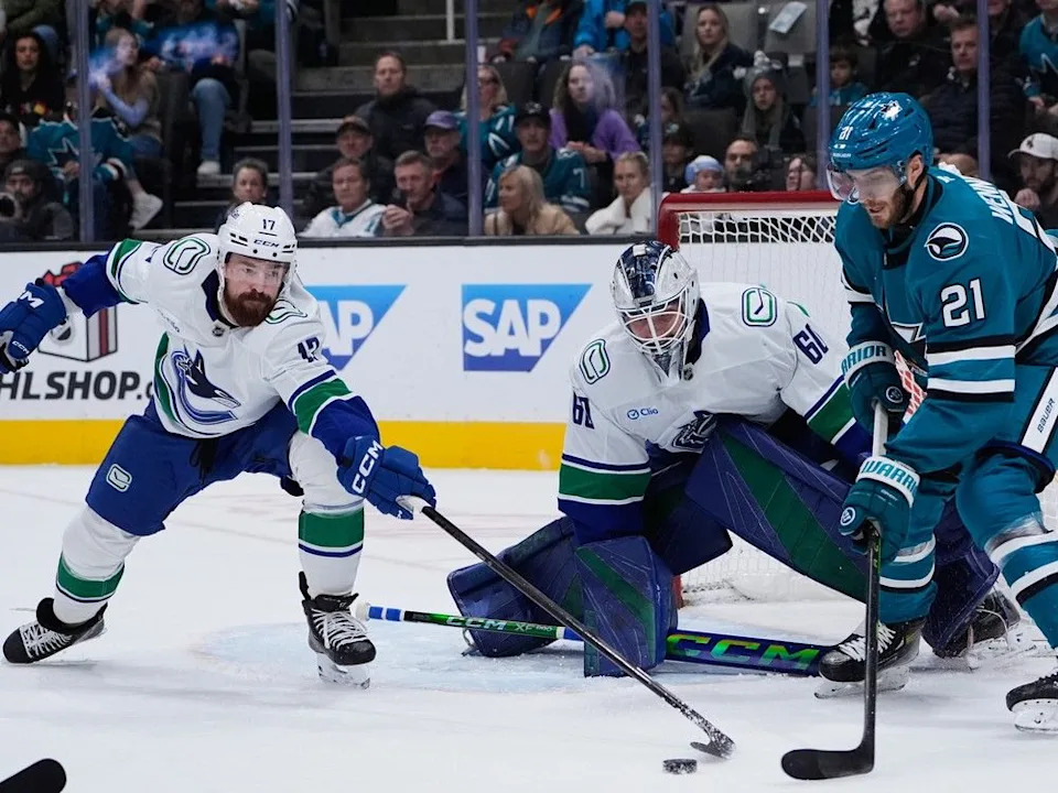  San Jose Sharks center Alexander Wennberg and Vancouver Canucks defenceman Filip Hronek during NHL game Nov. 28, 2025, in San Jose, Calif.