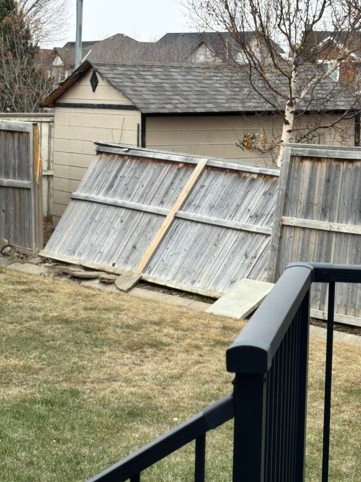Collapsed fence reported in Prairie Springs around 11 a.m. as strong winds moved through the Airdrie area Friday. Photo / Laurie Hutt
