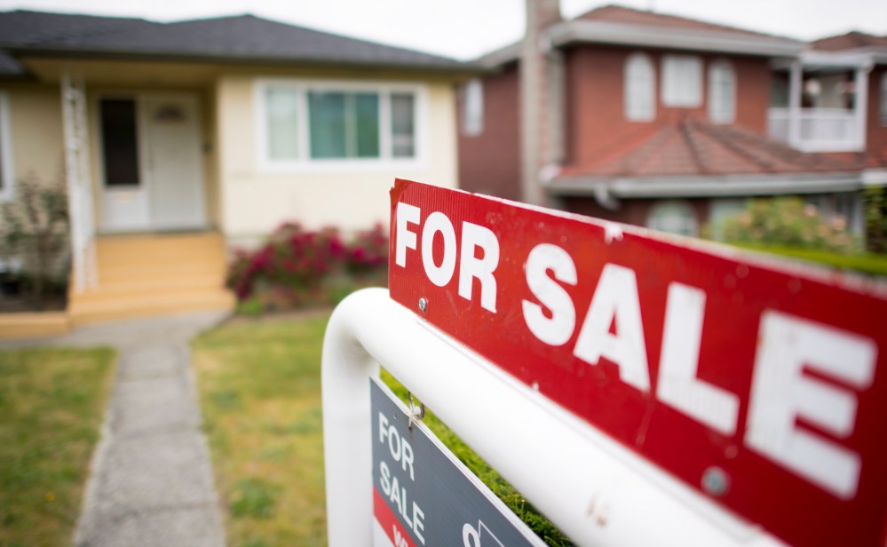 A real estate sign is pictured in Vancouver, B.C., Tuesday, June, 12, 2018. THE CANADIAN PRESS Jonathan Hayward