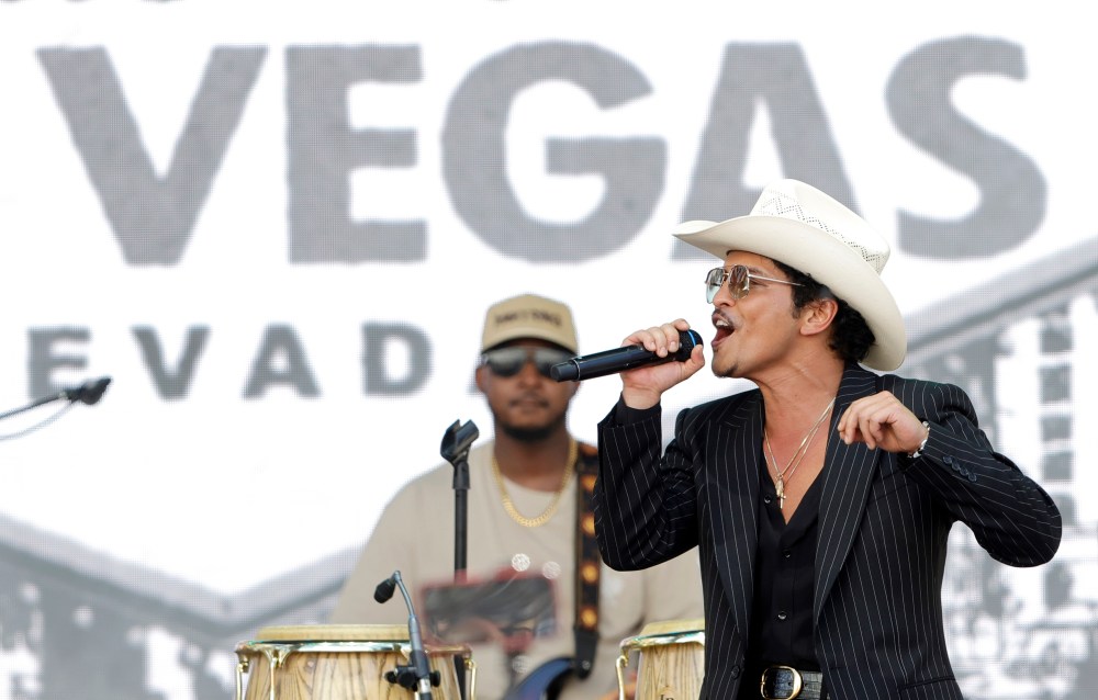Bruno Mars performs for fans in Toshiba Plaza after a parade down the Las Vegas Strip Friday, April 10, 2026, in Las Vegas, on