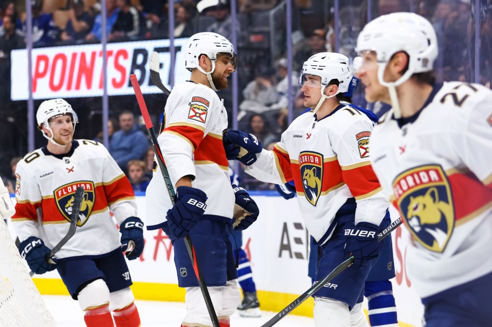 Florida Panthers forwards A.J. Greer (10) and Mackie Samoskevich (11) celebrate a goal against the Maple Leafs in Toronto on Saturday, April 11, 2026. THE CANADIAN PRESS/Cole Burston