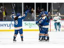 Vancouver Goldeneyes' Madison Samoskevich (7) celebrates her first goal with Katie Chan (9) and Anna Segedi (51) during the second period of a PWHL hockey game against the Seattle Torrent in Vancouver, on Tuesday, April 14, 2026.