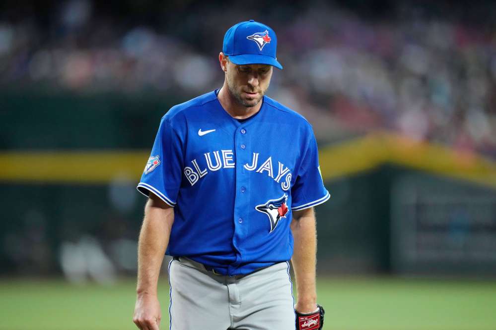 Toronto Blue Jays starting pitcher Max Scherzer walks off the field after retiring the Arizona Diamondbacks during the sixth inning of a baseball game, Saturday, April 18, 2026, in Phoenix. (AP Photo/Ross D. Franklin)
