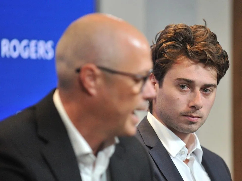  Vancouver Canucks GM Patrik Allvin and Quinn Hughes at the September 11, 2023 press conference when Hughes was named team captain.