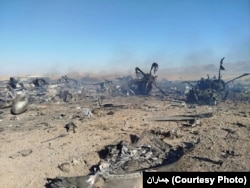 A photo released by Iran's Revolutionary Guards purporting to show aircraft destroyed during a US mission to find a stranded airman in Iran Media reports said two transport planes that were supposed to be part of the mission failed to leave a remote base in Iran. US officials said the aircraft were destroyed to keep Iran's military from obtaining them.