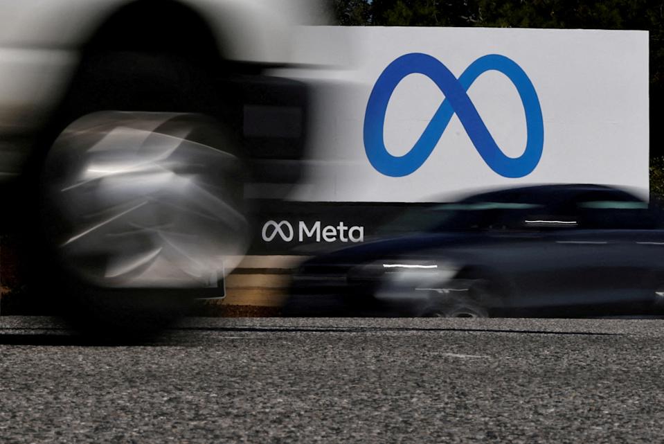 FILE PHOTO: Cars drive past a sign of Meta, the new name for the company formerly known as Facebook, at its headquarters in Menlo Park, California, U.S. October 28, 2021. REUTERS/Carlos Barria/File Photo