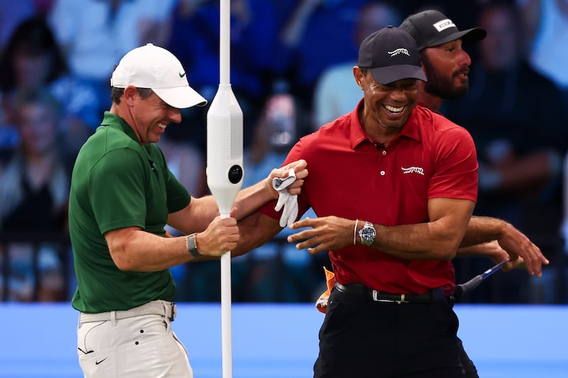 Tiger Woods of Jupiter Links GC and Rory McIlroy of Boston Common Golf react on the sixth hole during a match at SoFi Center on March 01, 2026 in Palm Beach Gardens, Florida. Photograph: Megan Briggs/TGL Golf via Getty Images