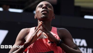 Sabastian Sawe holds up the Adidas supershoe which he wore in breaking the marathon world record in London