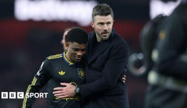 Manchester United winger Amad Diallo (left) with head coach Michael Carrick